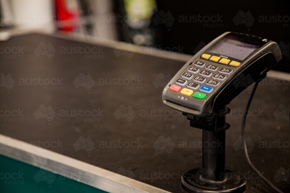 Black copy space with credit card terminal at checkout - Australian Stock Image