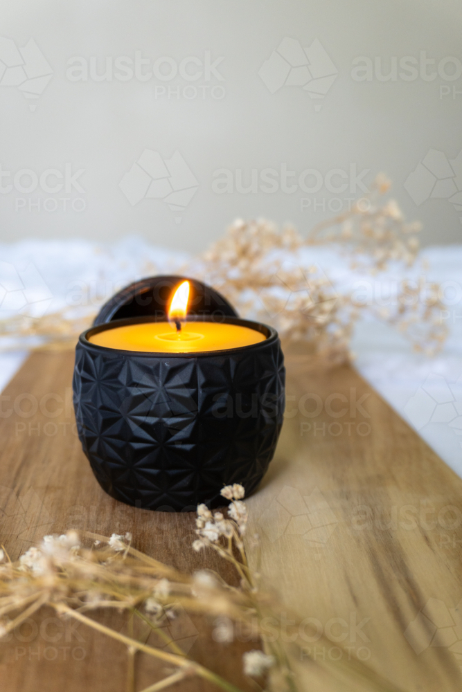 Black decorative candle - Australian Stock Image