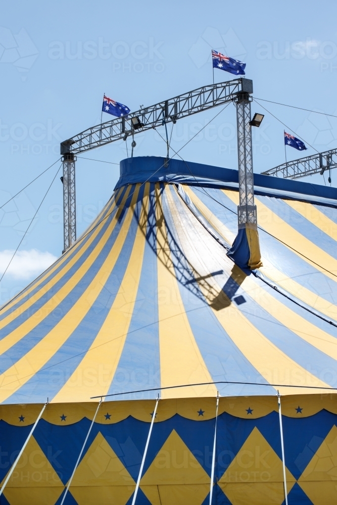 Blue and yellow circus tent with australian flag - Australian Stock Image