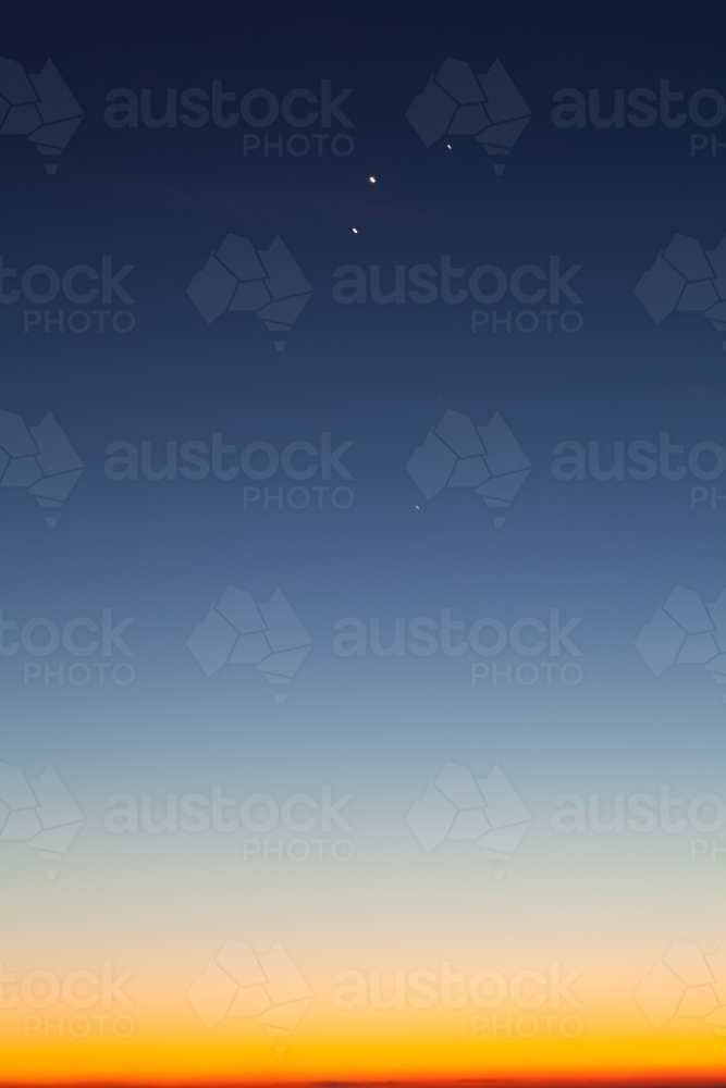 Blue and yellow dawn sky with planets aligned : Austockphoto Blue and yellow dawn sky with planets aligned - Australian Stock Image
