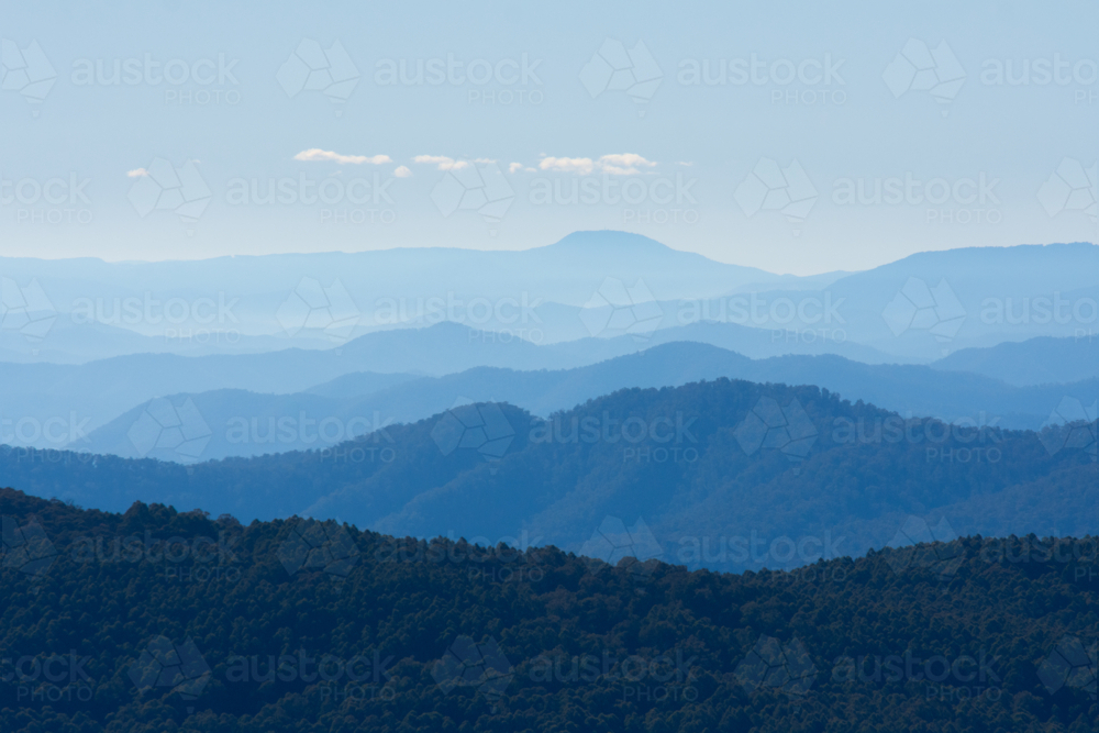 Blue, hazy view of mountain ranges - Australian Stock Image