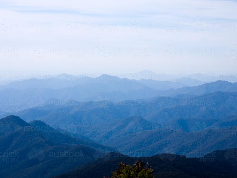 Blue hills receding into the distance with a blue sky - Australian Stock Image