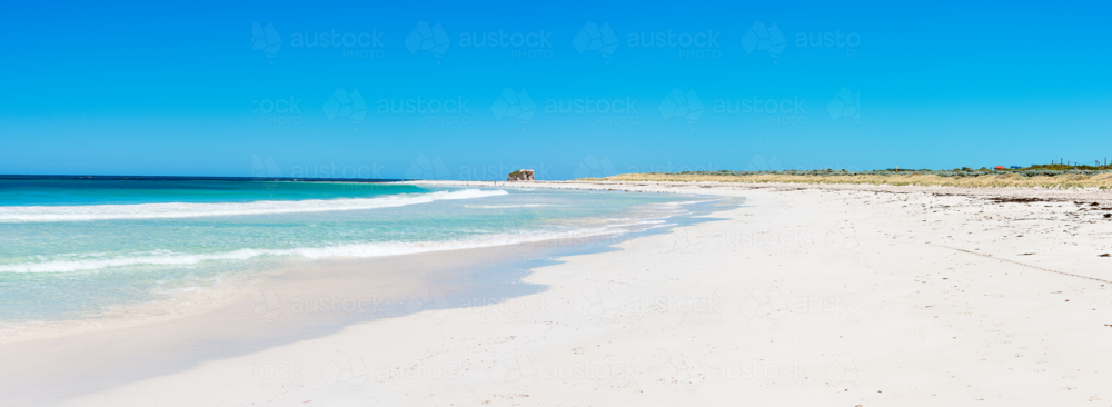 Blue skies white sands & turquoise ocean at two rocks beach - Australian Stock Image