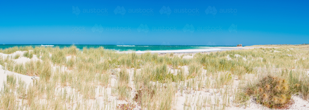 Blue skies white sands & turquoise ocean at two rocks beach - Australian Stock Image