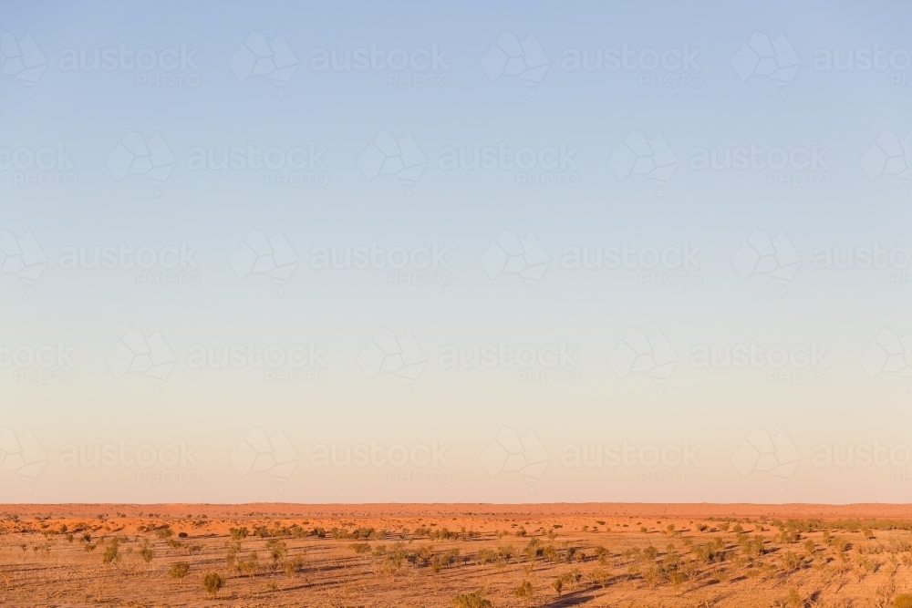 Blue sky and red dirt in outback australia - Australian Stock Image