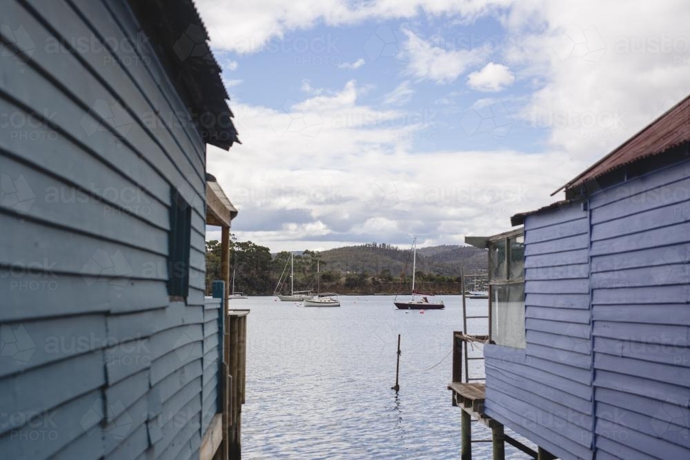 Blue walls of boat houses at Cornelian Bay - Australian Stock Image