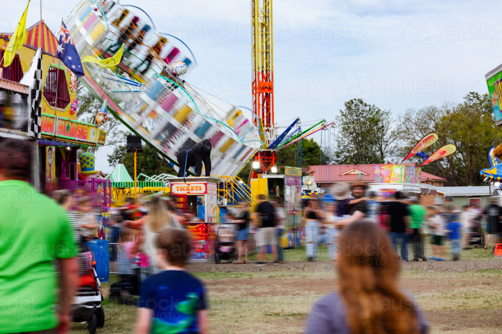 Sideshow Ride Ally Image of Blurred crowd and show ride down sideshow alley at local ...