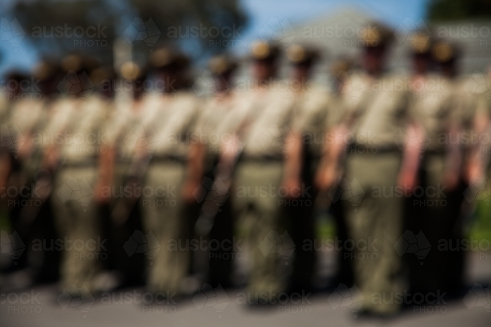 Blurred image of soldiers standing to attention - Australian Stock Image