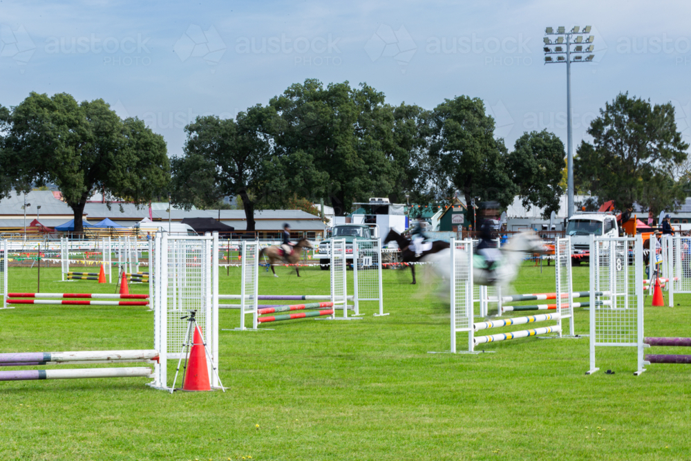 Even Rider Image of blurred motion of anonymous event rider competing in ...