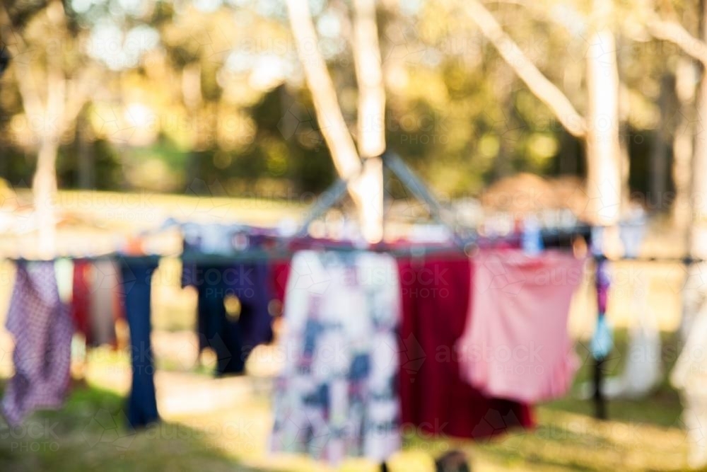 Blurred out of focus photo of a full washing line - Australian Stock Image