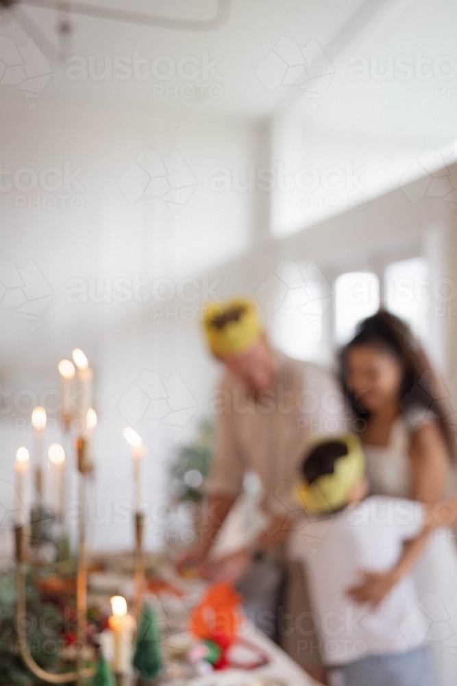 Blurred photo of family at Christmas table - Australian Stock Image