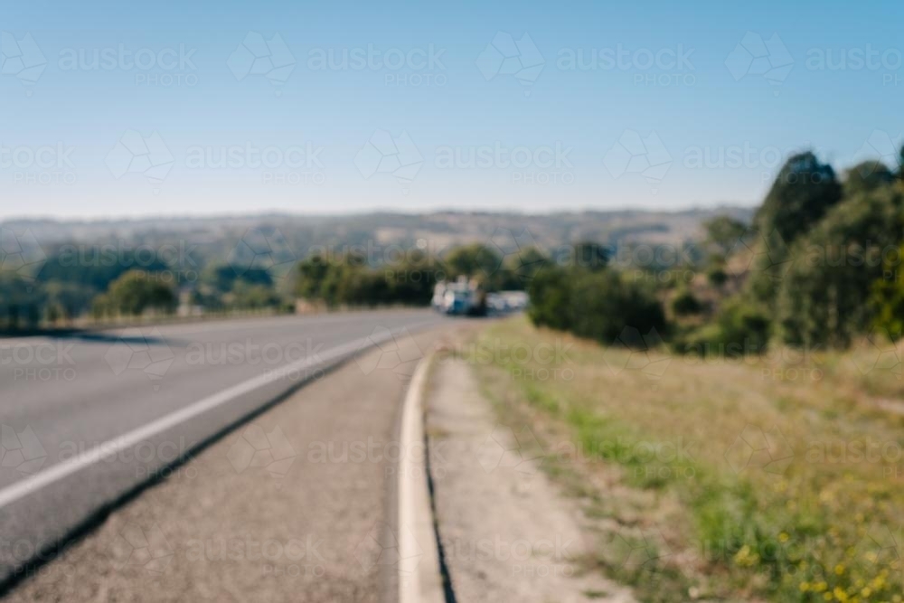 blurry image of a highway with cars approaching - Australian Stock Image