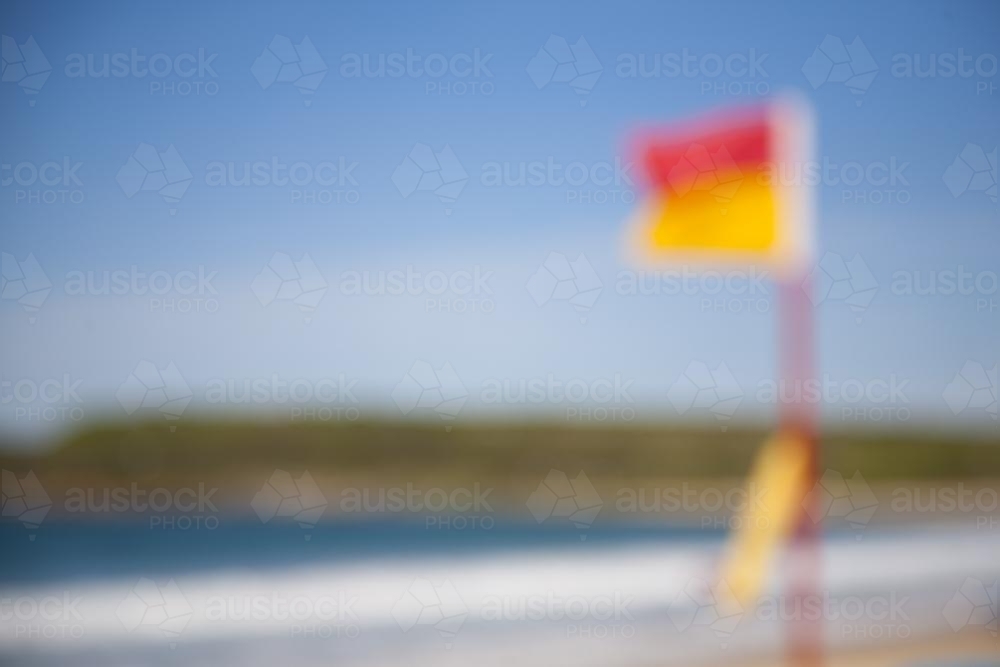 blurry image of a lifesaving flag at bondi beach - Australian Stock Image