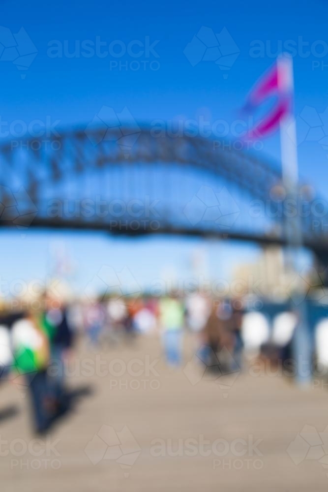 Blurry image of a the sydney harbour bridge and people - Australian Stock Image