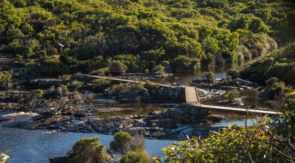 Board walk track over river in bushland - Australian Stock Image