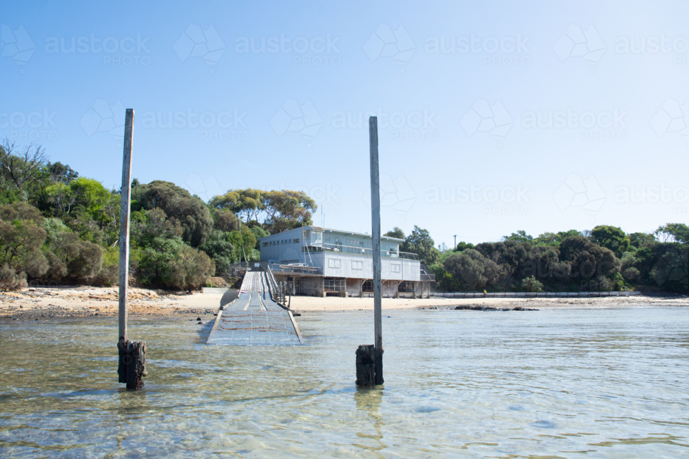 Boat club on edge of calm water and bush - Australian Stock Image
