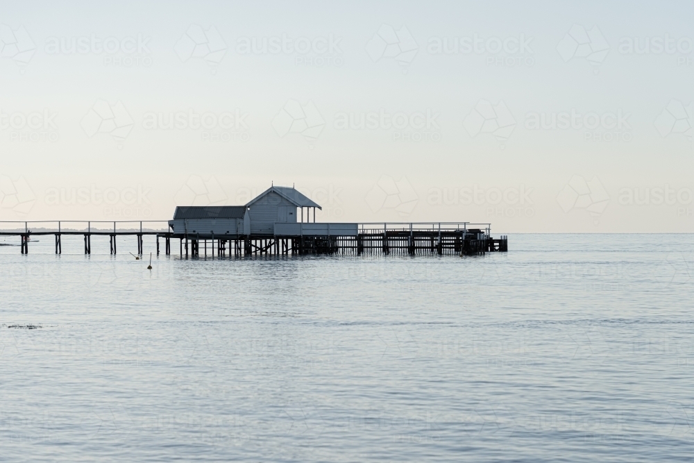 Boat sheds on the bay at dusk - Australian Stock Image