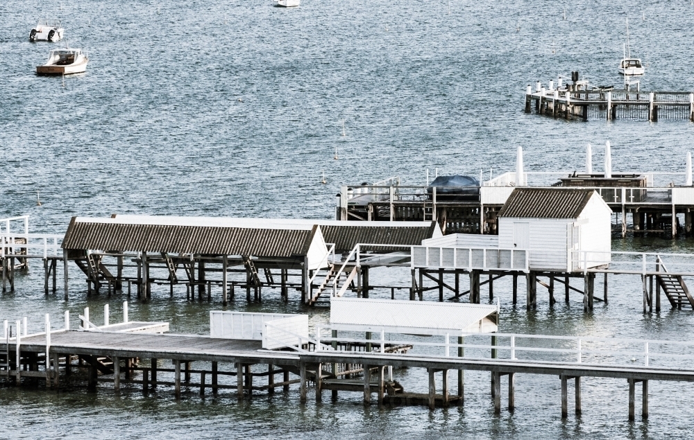 boat sheds on the water - Australian Stock Image