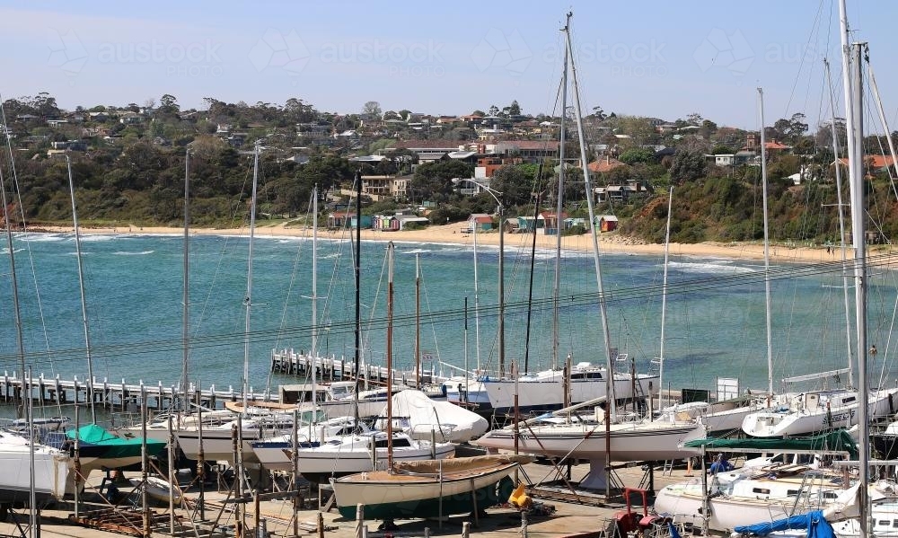 Boats beside ocean on a sunny day at Mount Martha beachfront - Australian Stock Image