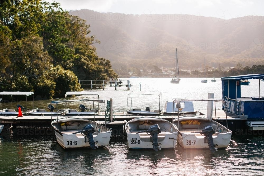 Boats docked at a jetty - Australian Stock Image