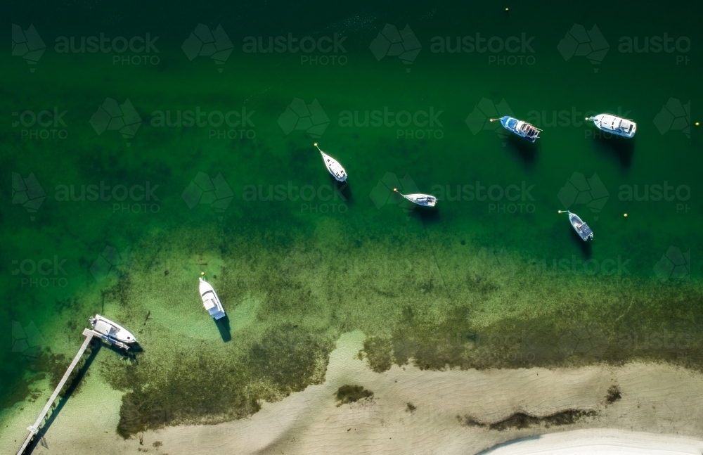 Boats moored near a jetty - Australian Stock Image