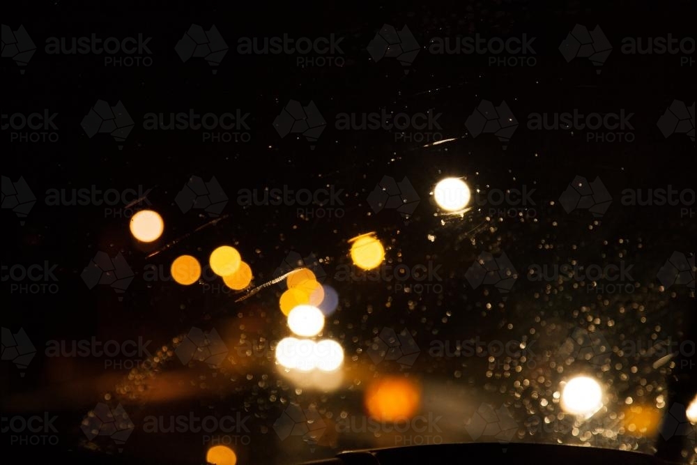 Bokeh of street and car lights at night in the rain - Australian Stock Image