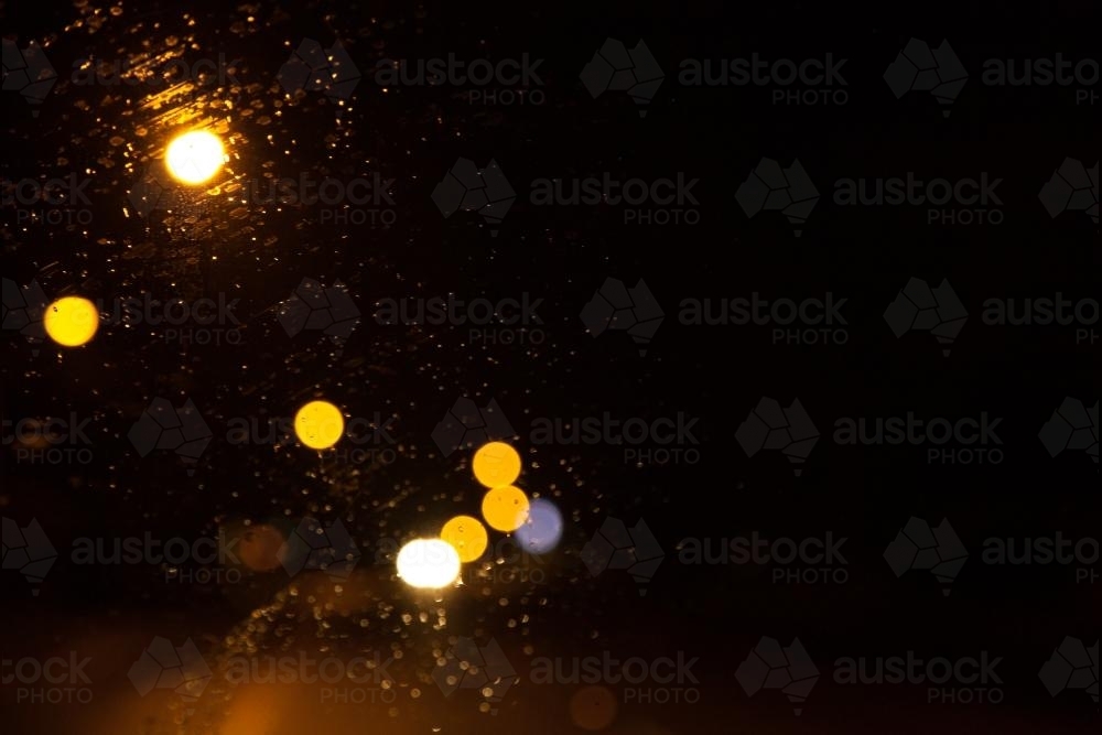 Bokeh street and car lights on the windshield at night - Australian Stock Image