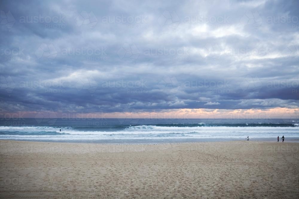 Bondi beach at sunset with storm clouds - Australian Stock Image