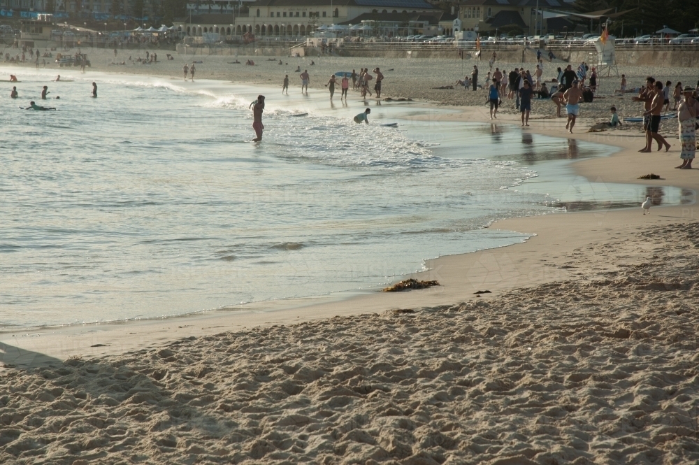 Bondi Beach late afternoon with people strolling - Australian Stock Image