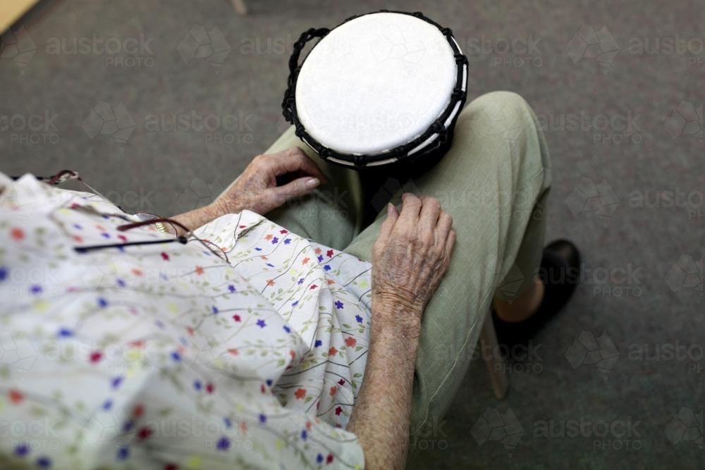 Bongo drumming session detail at retirement village - Australian Stock Image
