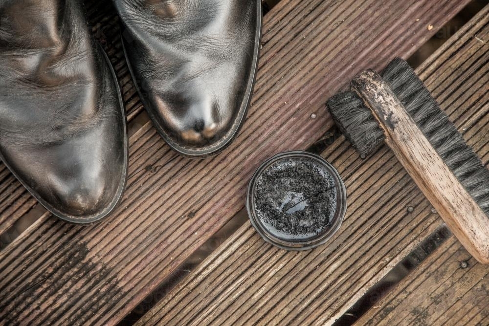 Boots and shoe polish and brush - Australian Stock Image