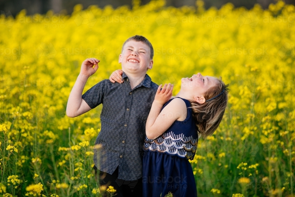Bother and sister laughter - Australian Stock Image