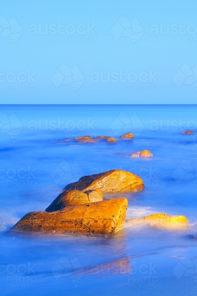 Boulders at the ocean's edge. - Australian Stock Image