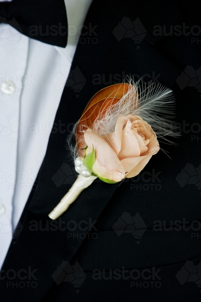 boutonniere groom flower on suit - Australian Stock Image