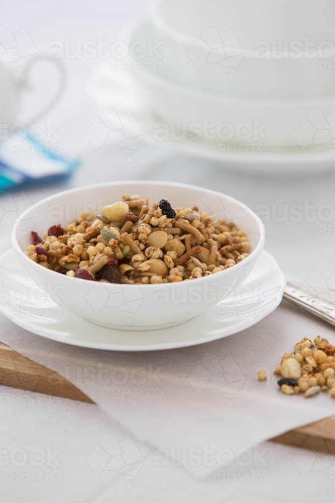 Bowl of organic Granola served at a table - Australian Stock Image