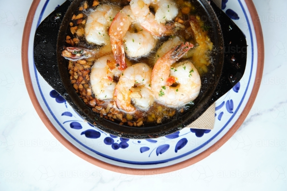 Bowl of shrimps sauteed in butter and garlic : Austockphoto Bowl of shrimps sauteed in butter and garlic - Australian Stock Image
