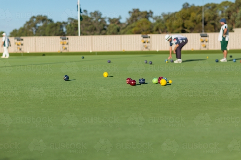 Bowling green with lawn bowlers and bowls - Australian Stock Image