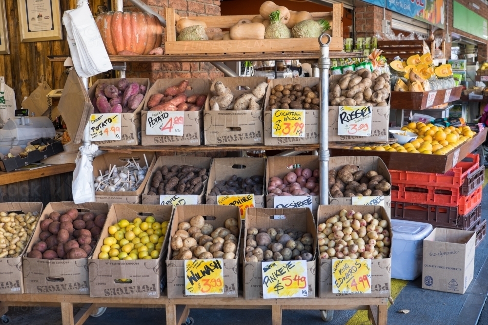 Image of Boxes of potatoes for sale at the market Austockphoto
