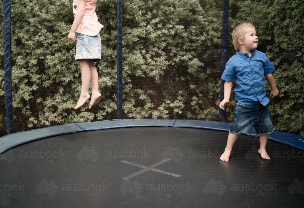 Boy and Girl on Trampoline - Australian Stock Image