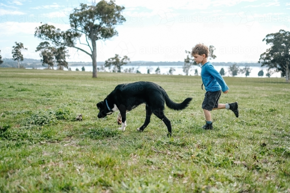 Boy and his dog on the farm - Australian Stock Image
