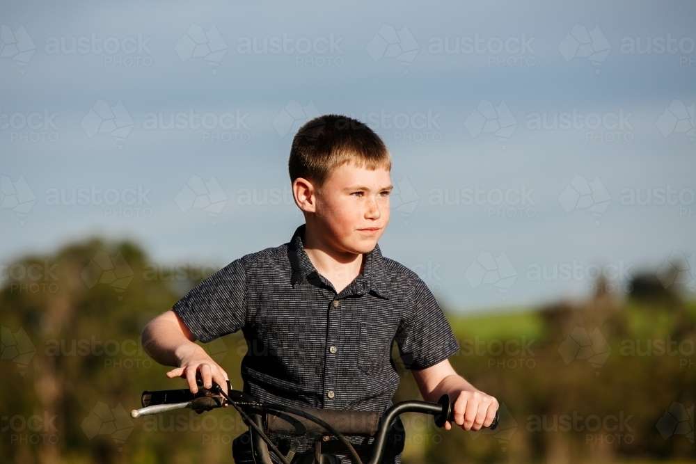 Boy and motorbike - Australian Stock Image