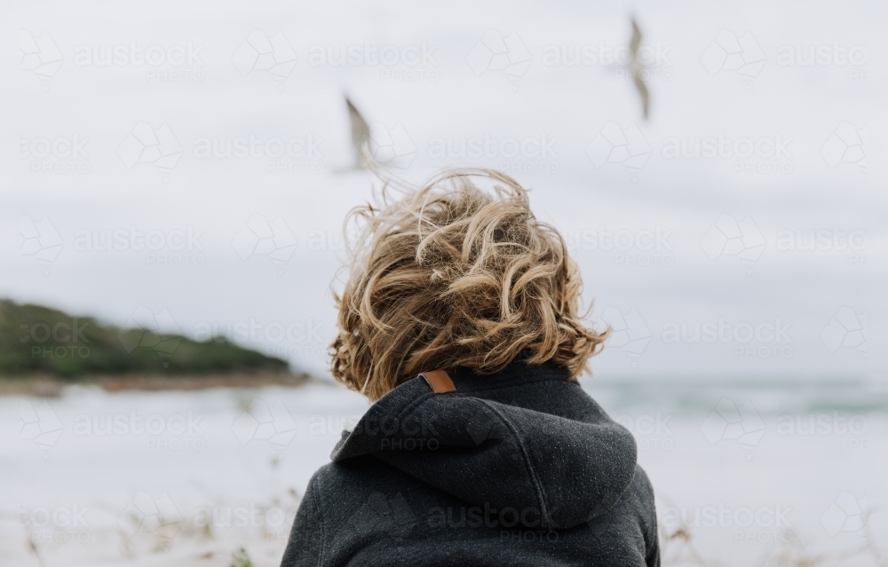 Boy looking at ocean - Australian Stock Image