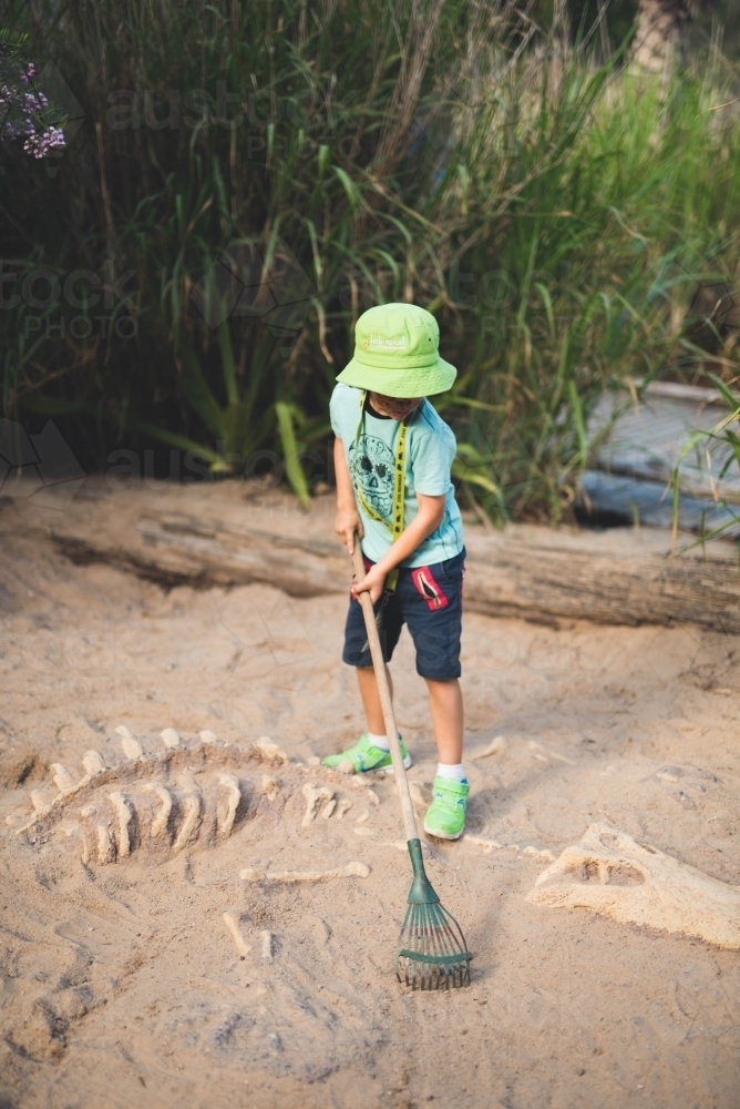 Boy playing in the sand - Australian Stock Image