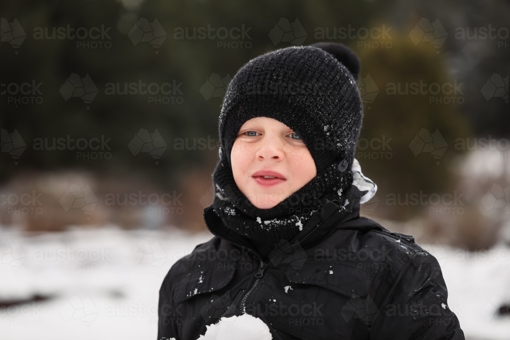 Boy playing in the snow. Winter at Shooter's Hill NSW - Australian Stock Image