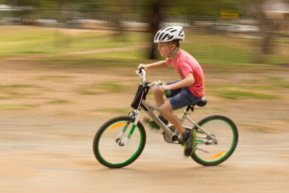 Boy riding bike - Australian Stock Image