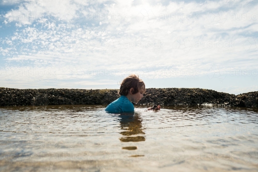 Boy swimming in Rockpool - Australian Stock Image