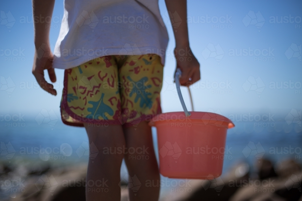Boy with bucket - Australian Stock Image