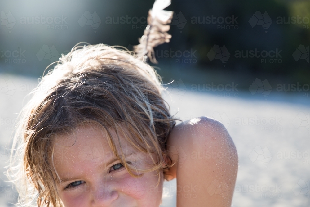 Boy with feather - Australian Stock Image