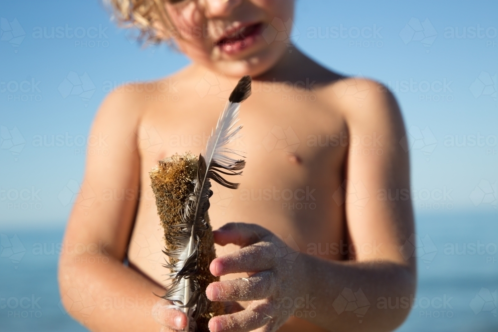Boy with feather - Australian Stock Image