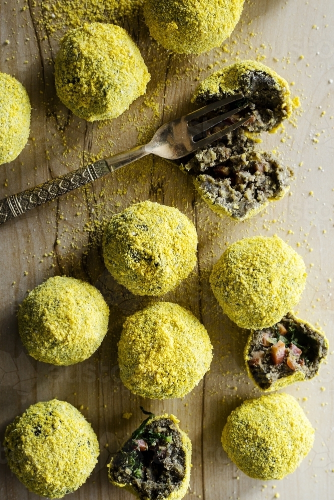 Brazilian Vegetarian Balls on chopping board - Australian Stock Image